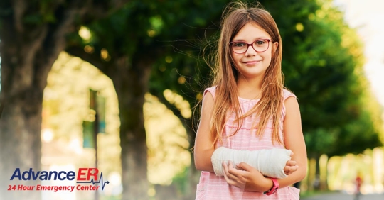 young girl with cast on arm