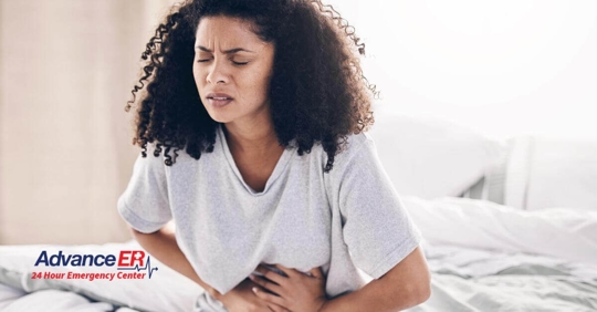 Woman holding her stomach.