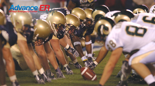 Football players on the field at a high school game