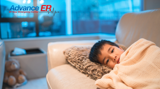 Child lying with a pillow and blanket