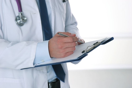 doctor taking notes in office