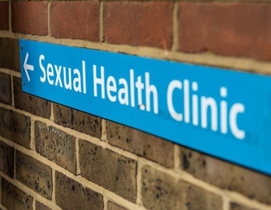 Sign on building reading "Sexual Health Clinic"
