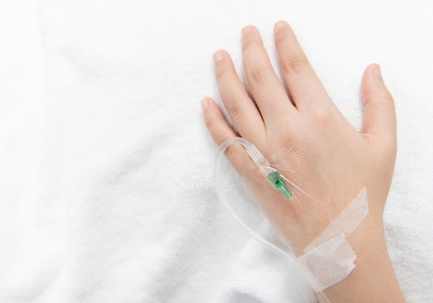 Patient receiving IV ketamine treatment in emergency room.