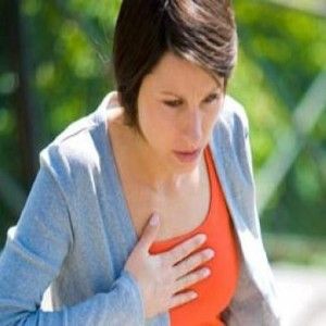 Woman clutching chest