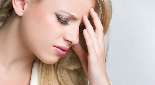 Woman suffering from a headache